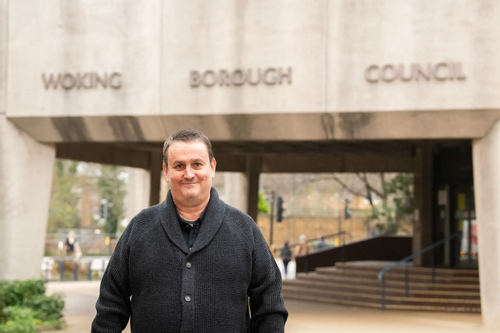 Andy Caulfield SWAG Chair outside Woking Council Office