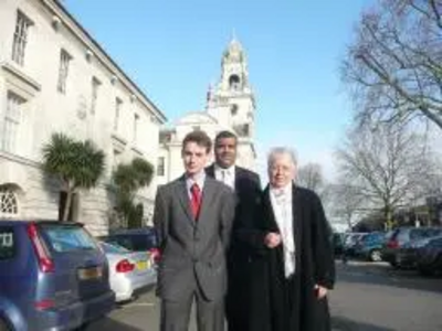 Woking County Councillors Diana Smith, Mohammed Amin, and Will Forster at County Hall